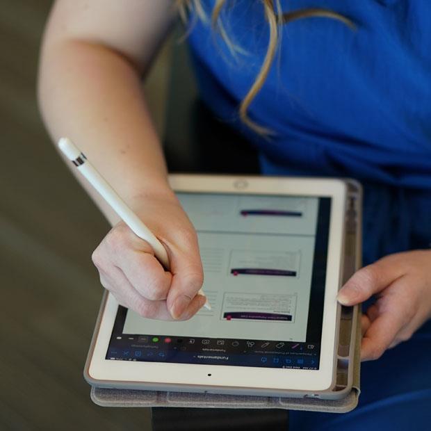 Student taking notes