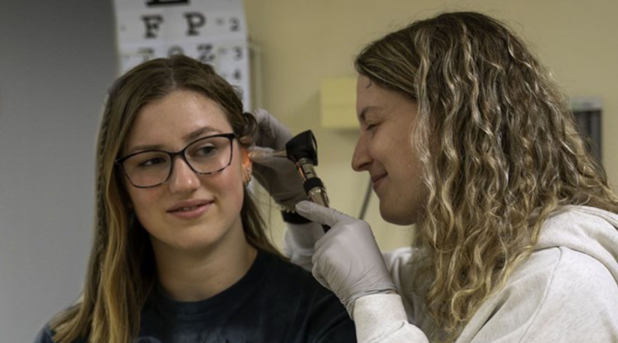 Photo of students in the Nursing Lab